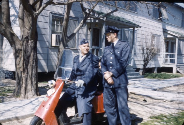 Larry in Capt. uniform w Col. Thaxton on scooter